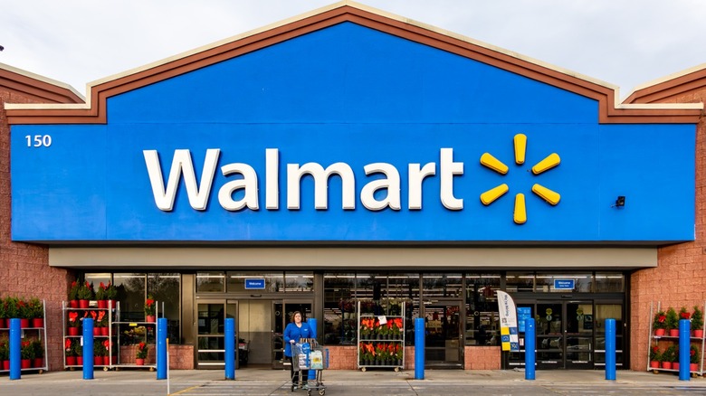 Outside of a Walmart with shopper pushing cart