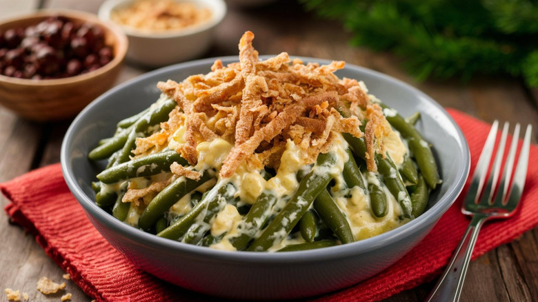 green bean casserole served in plate with fried onions