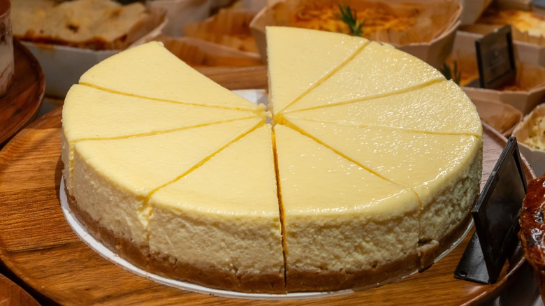 Sliced up cheesecake with one slice missing