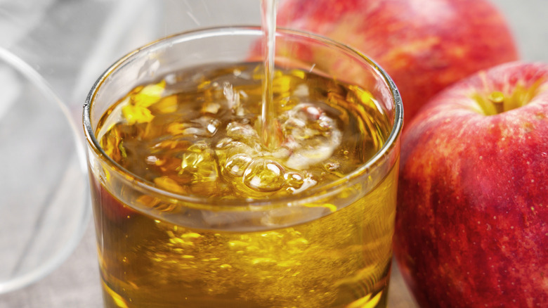 Apple juice poured into glass