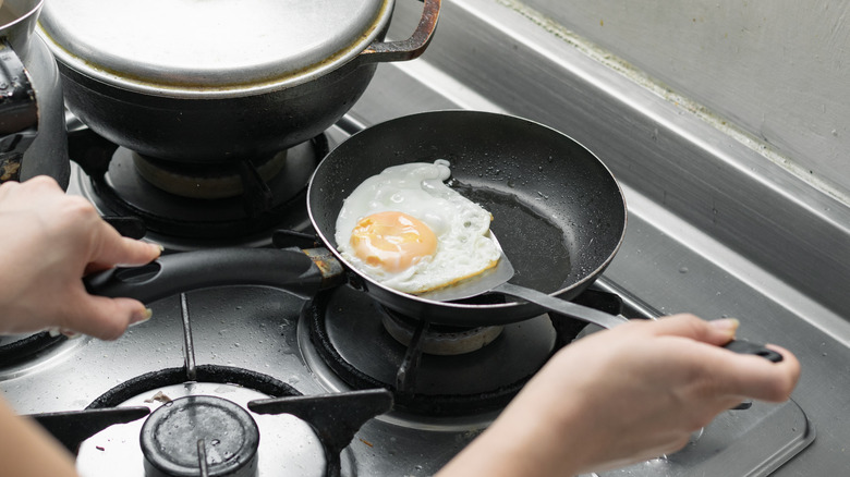 Person flipping egg with a spatula