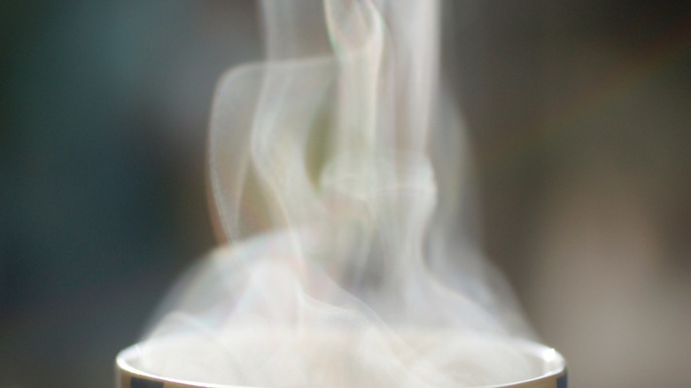 Stock photo of steam rising from a coffee cup.