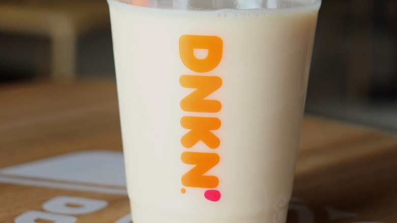 A stock photo of a glass of Dunkin' milk tea.