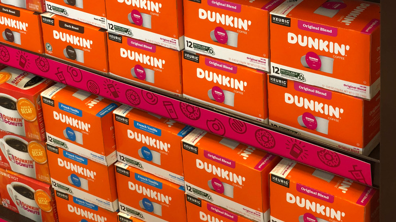 Stock photo of a shelf of Dunkin' coffee Keurig cups.