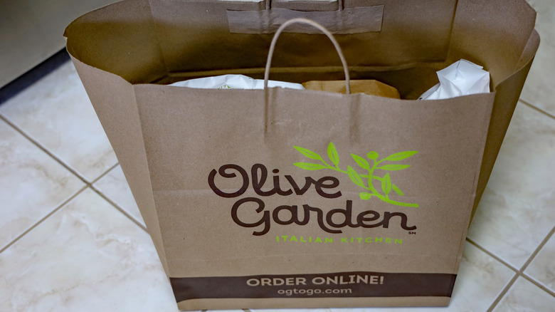 Olive Garden paper bag full of takeout