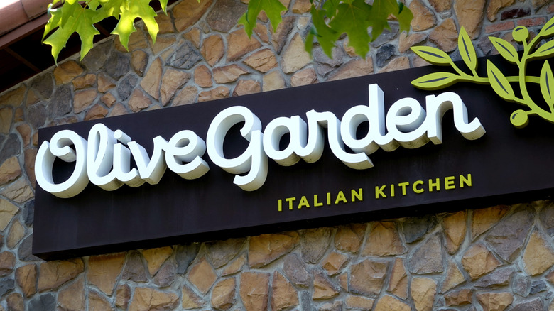 Olive Garden sign on stone wall