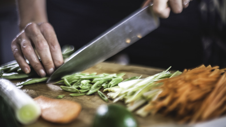 Person chopping up ingredients