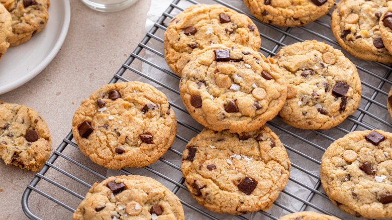 A fresh batch of chocolate chip cookies on a cooling rack