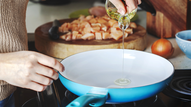 cooking meal in pan with oil