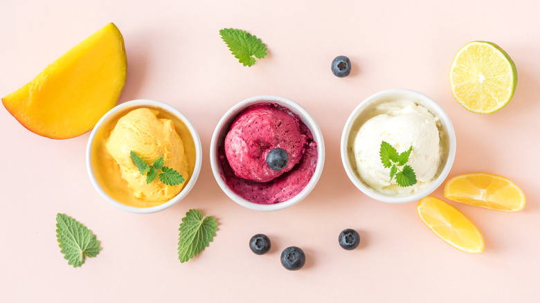 Assorted fruit sorbets in small white bowls