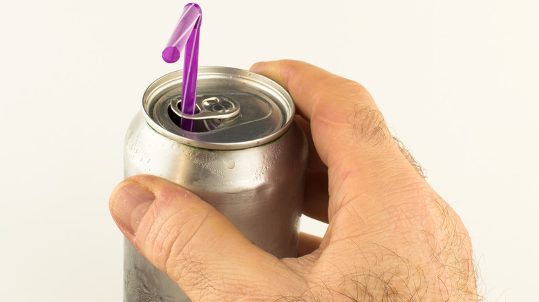 soda with straw in tab