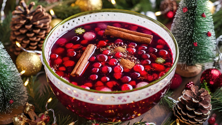 Holiday punch bowl with cranberries and cinnamon sticks