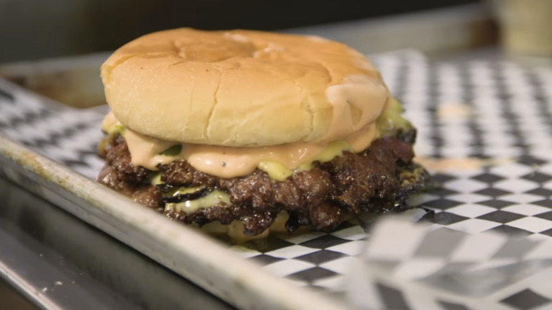 smashburger resting on tray