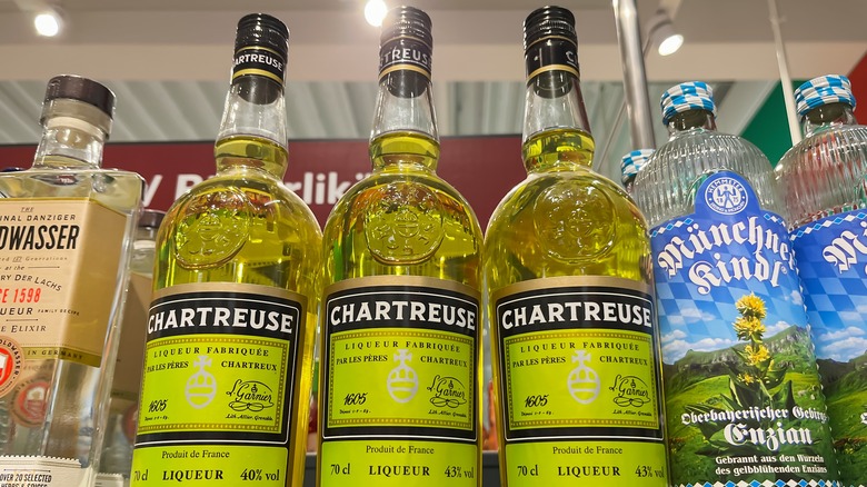 Green chartreuse bottles on a shelf