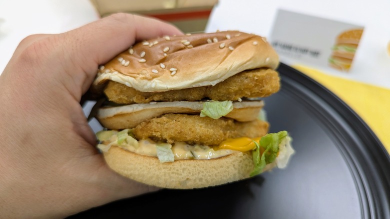 hand holding chicken big mac