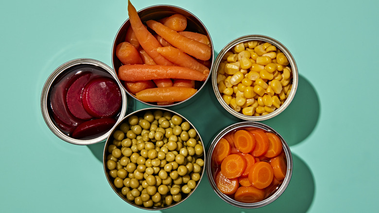 Top view of assorted open cans of vegetables