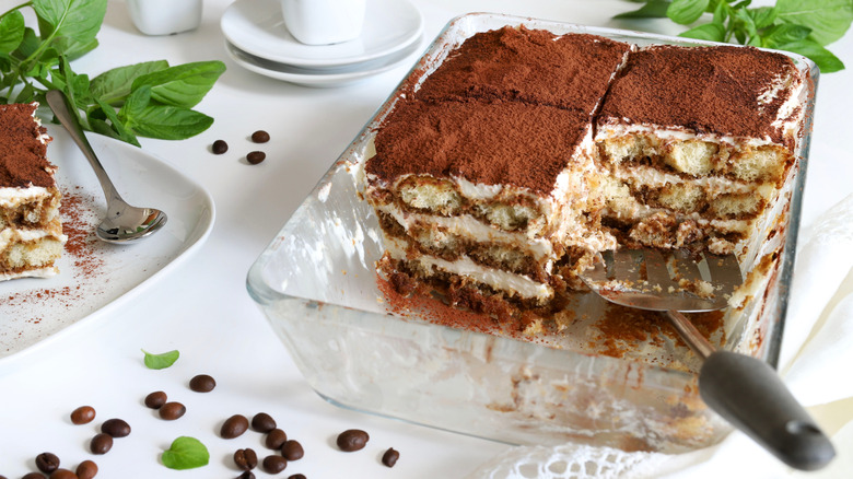 Three pieces of tiramisu left in a glass baking dish