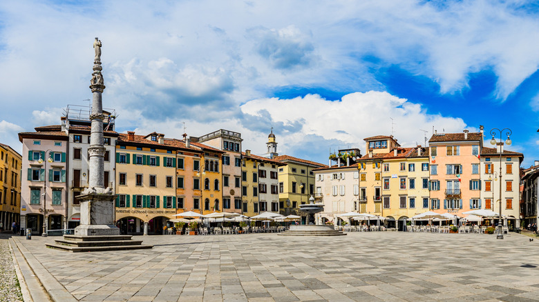 Multicolored buildings in the city square of Udine, italy