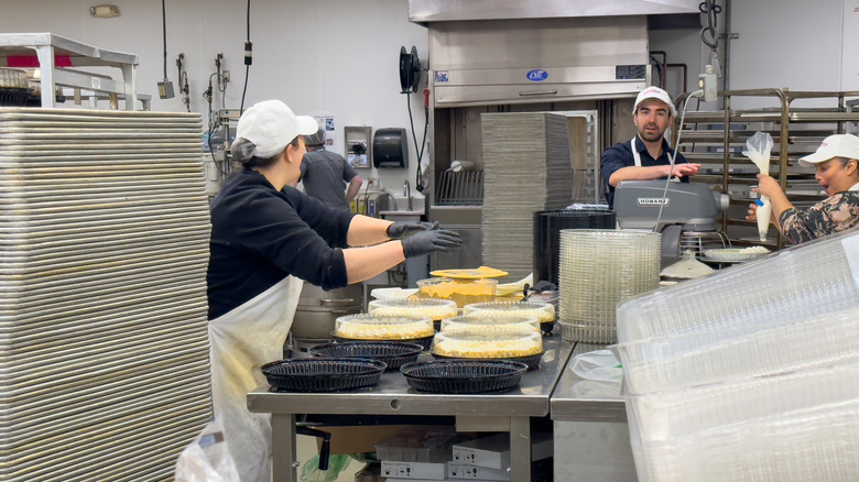 Costco bakery workers creating cakes