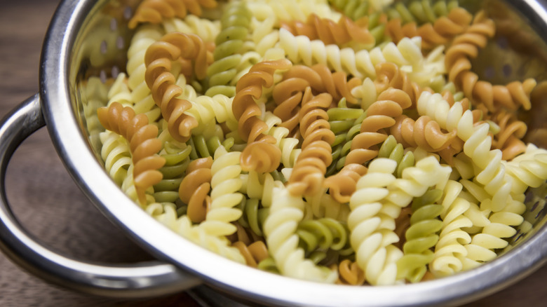 Corkscrew noodles in a strainer