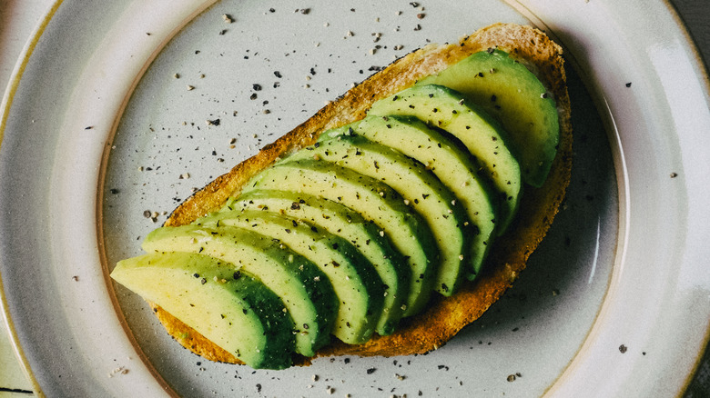 sliced avocado and pepper on toast