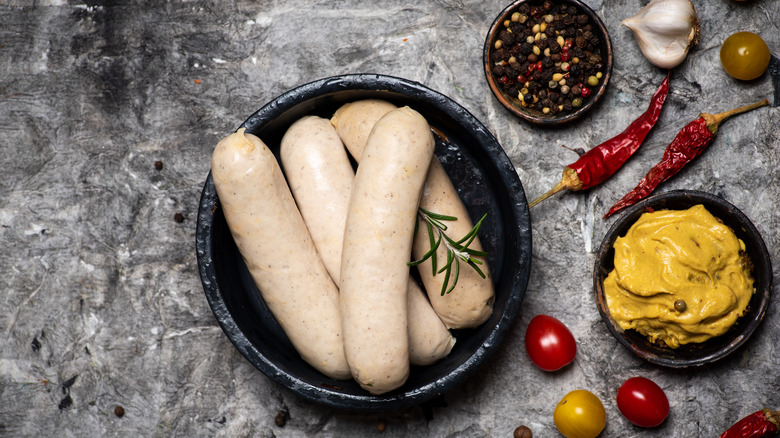 White sausages in black bowl