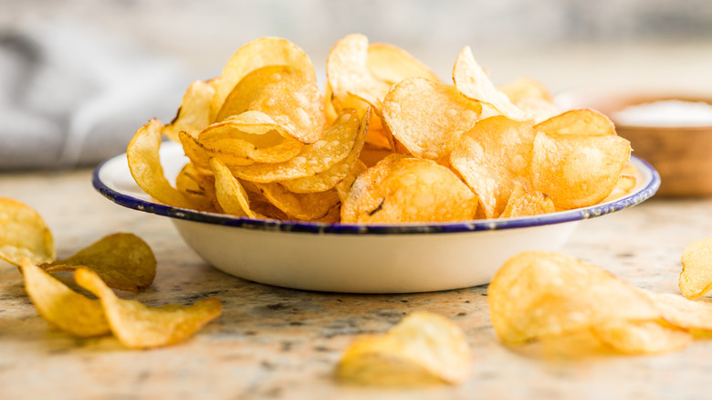 crispy potato chips in bowl