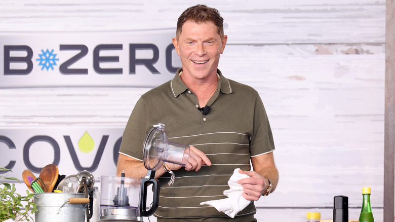 Bobby Flay smiles and cooks