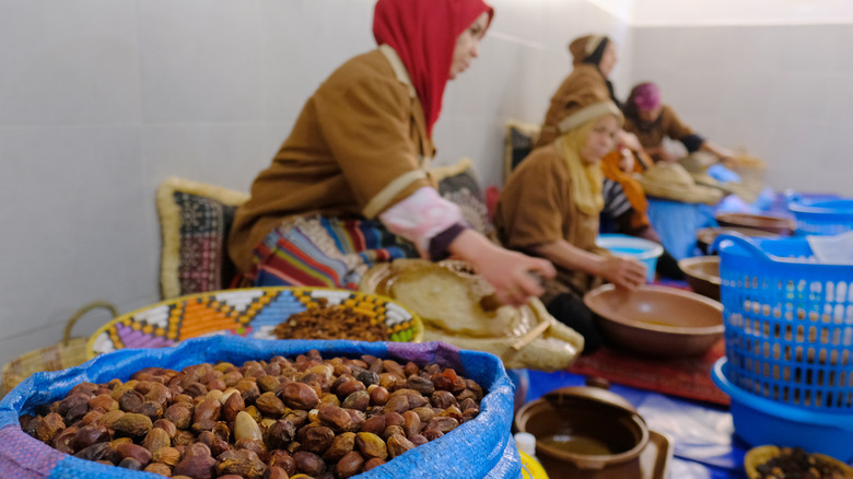 Moroccan women hand-grind argan nuts