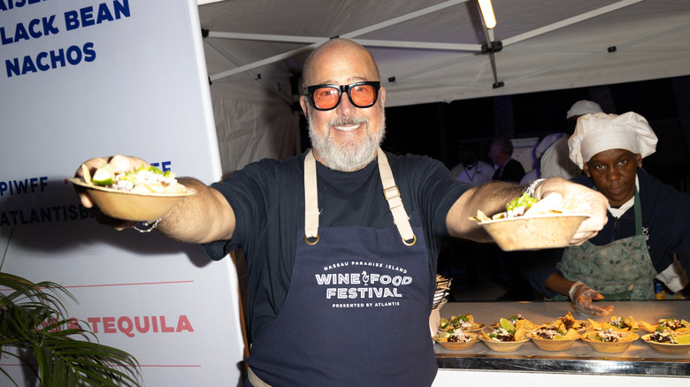 andrew zimmern holding food