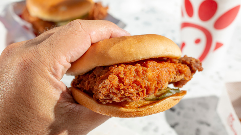 hand holding a Chick-fil-A chicken sandwich