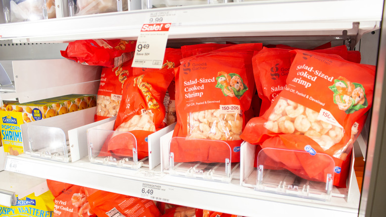 bags of shrimp in a freezer