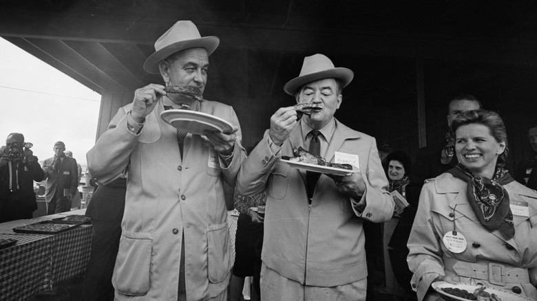 Lyndon B. Johnson and Hubert Humphrey eating BBQ ribs