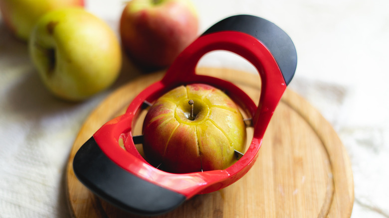 apple slicer in the middle of an apple