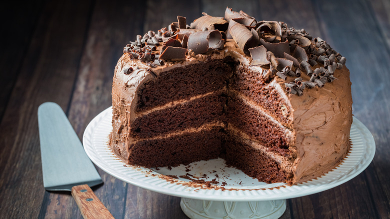 chocolate layered cake with one slice neatly cut out