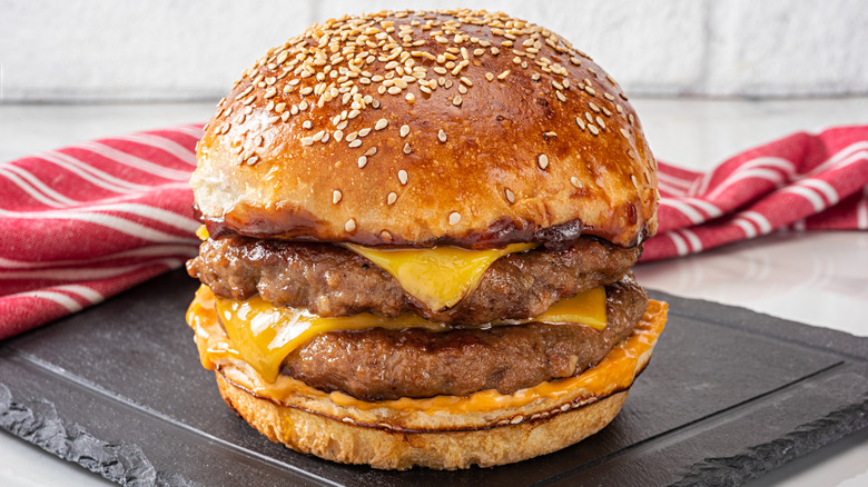 Cheeseburger with cheese on bottom bun