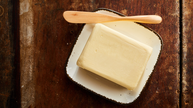 a pat of butter with spreader