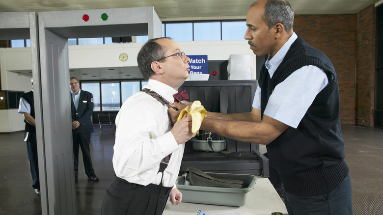 man with banana at customs