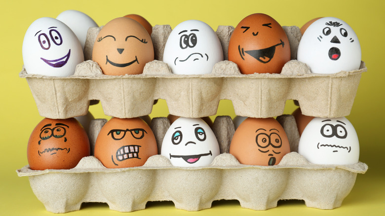 Eggs in cartons, painted with many emotions