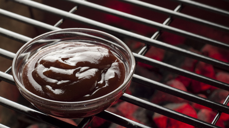 barbecue sauce bowl on grill