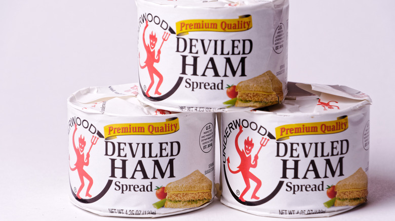 three stacked cans of Underwood canned deviled ham spread