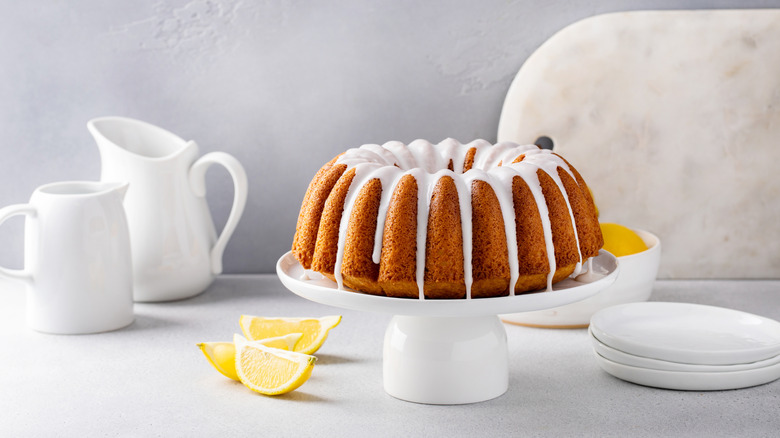 Icing-covered Bundt cake served on a platter.