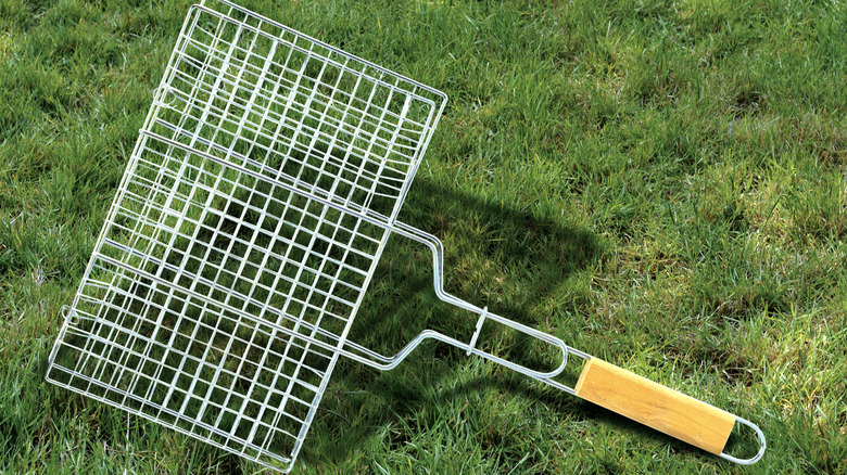 enclosed grill basket on grass