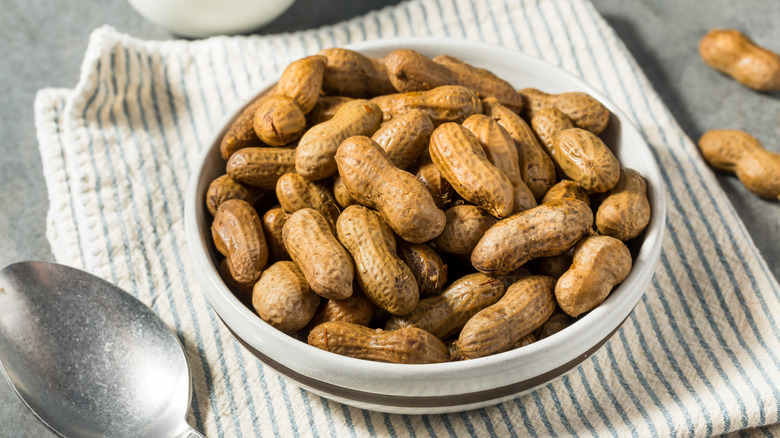 A dish full of boiled peanuts.