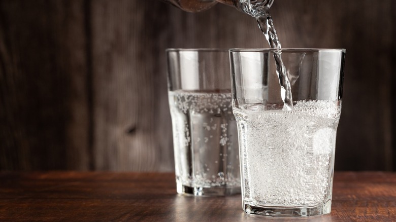 Two glasses filled with carbonated water