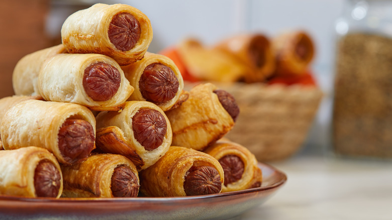 Cocktail wewiners wrapped in puff pastry dough, also called 