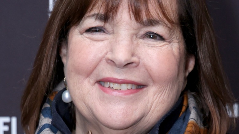 Ina Garten wearing a pearl drop earring and a patterned scarf