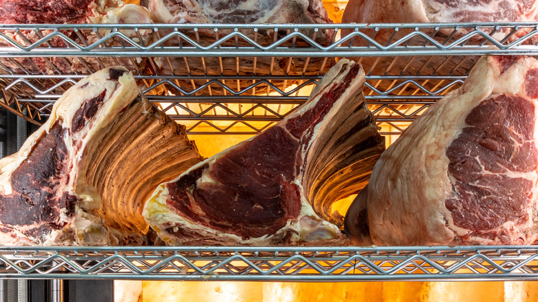 beef dry aging on metal racks