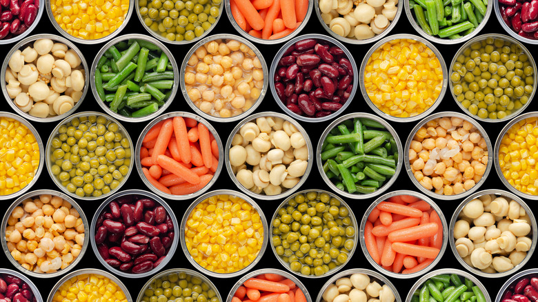 an aerial view of many open cans of vegetables