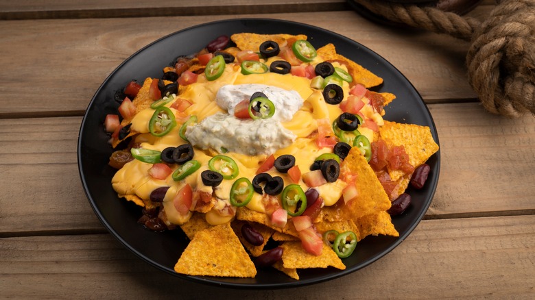 Plate of nachos with melted cheese